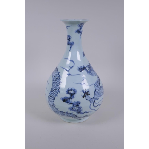 121 - A Chinese blue and white porcelain pear shaped vase, decorated with a dragon in flight, 32cm high