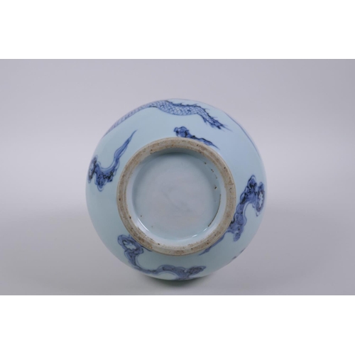 121 - A Chinese blue and white porcelain pear shaped vase, decorated with a dragon in flight, 32cm high