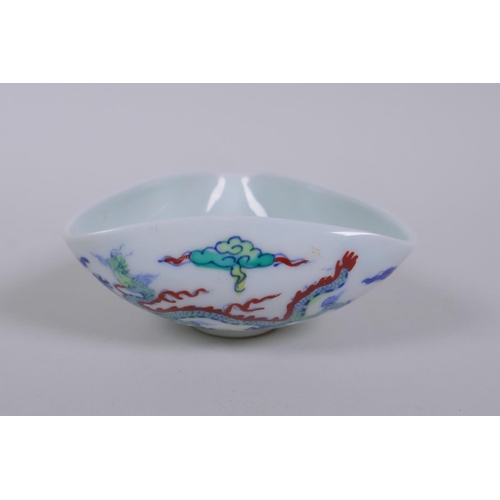 126 - A Doucai porcelain bowl of triangular form decorated with dragons in flight, Chinese Chenghua 6 char... 
