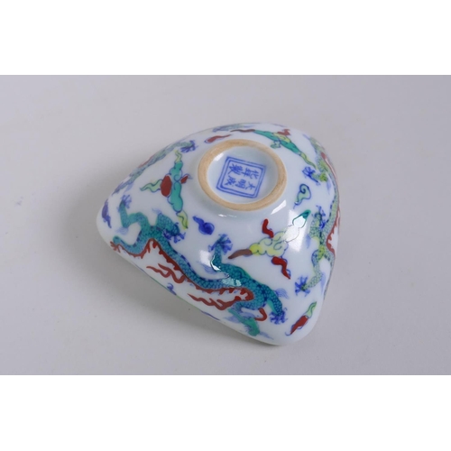 126 - A Doucai porcelain bowl of triangular form decorated with dragons in flight, Chinese Chenghua 6 char... 