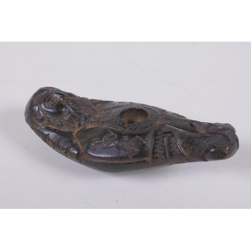 131 - An antique Syrian carved hardstone figural oil lamp, 12cm long
