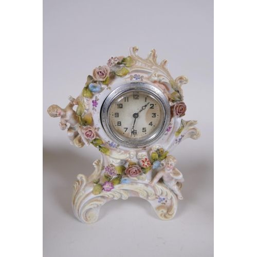 132 - A collection of late C19th/early C20th Dresden porcelain, including a desk clock, trinket dishes, ri... 