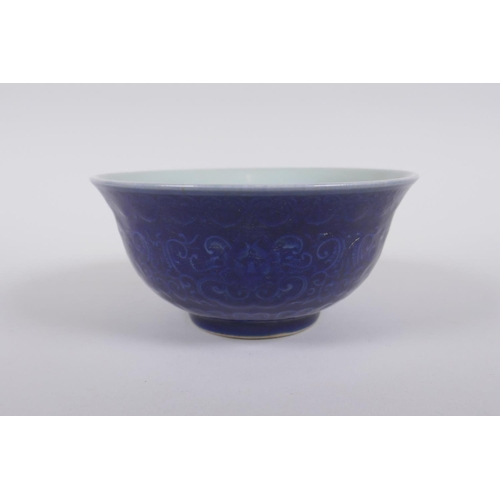 138 - A Chinese blue glazed porcelain bowl with underglaze lotus flower decoration, Xuande 6 character mar... 