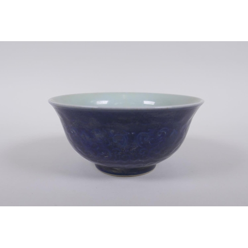 138 - A Chinese blue glazed porcelain bowl with underglaze lotus flower decoration, Xuande 6 character mar... 