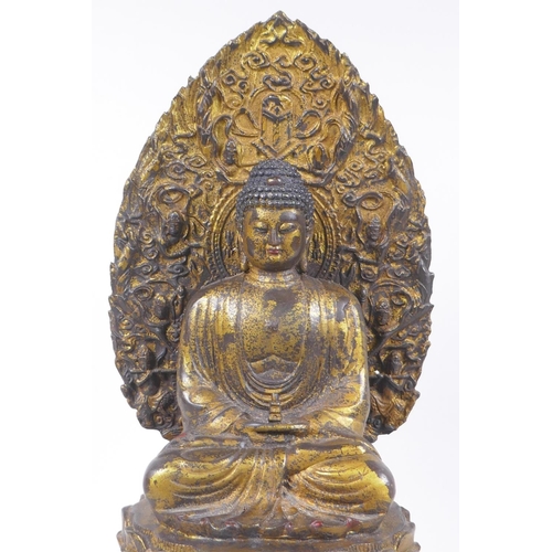 145 - A Sino Tibetan gilt metal figure of Buddha seated on a lotus flower, 37cm high