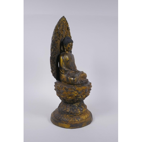 145 - A Sino Tibetan gilt metal figure of Buddha seated on a lotus flower, 37cm high