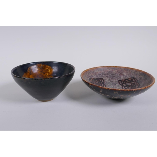 146 - A Chinese Cizhou kiln conical bowl with leaf skeleton decoration and another with lotus flower decor... 