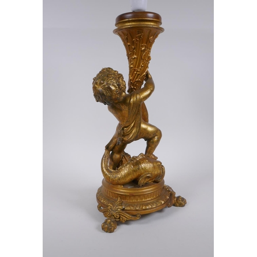 147 - A gilt metal putti and dolphin table lamp, 44cm high