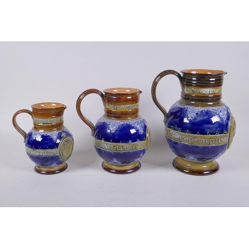 154 - A set of three Queen Victoria Diamond Jubliee Doulton Lambeth graduated stoneware jugs, all three de... 