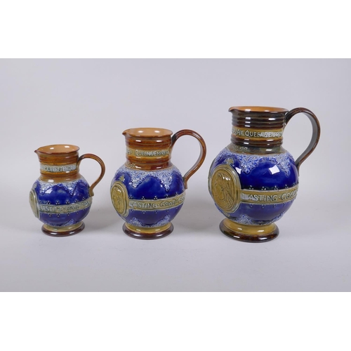 154 - A set of three Queen Victoria Diamond Jubliee Doulton Lambeth graduated stoneware jugs, all three de... 
