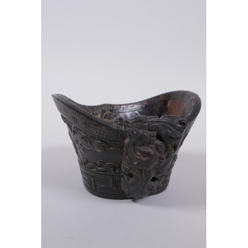 156 - A Chinese horn libation cup with carved kylin decoration, mark to base, 14 x 12cm, 8cm high