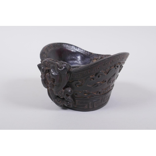 156 - A Chinese horn libation cup with carved kylin decoration, mark to base, 14 x 12cm, 8cm high