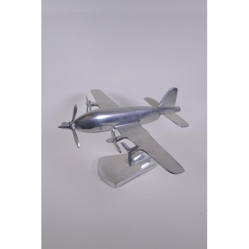 169 - A decorative polished aluminium model of a plane with five propellers, 43cm wingspan