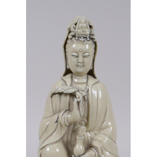 175 - A Chinese blanc de chine porcelain Quan Yin seted on a lotus flower, impressed mark verso, 26cm high