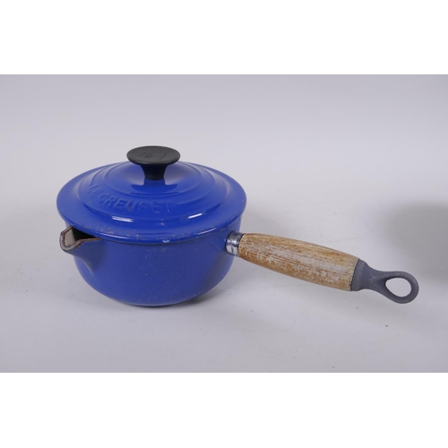 179 - A Le Creuset 21cm cast iron casserole dish, a smaller sauce pan with pouring spout and a milk pan wi... 