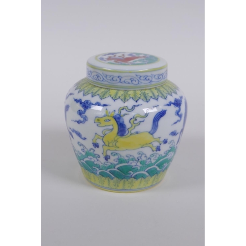 183 - A Chinese Wucai porcelain ginger jar and cover, decorated with mythical creatures, character mark to... 