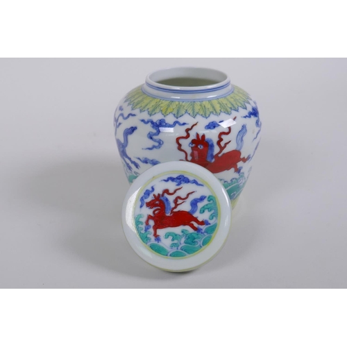 183 - A Chinese Wucai porcelain ginger jar and cover, decorated with mythical creatures, character mark to... 