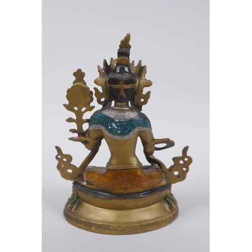 185 - A Sino Tibetan cold painted metal figure of a female deity, 21cm high