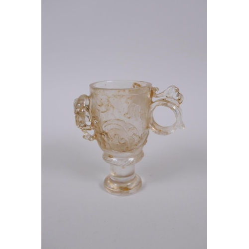 190 - A Chinese moulded glass libation cup with kylin decoration, 10cm high