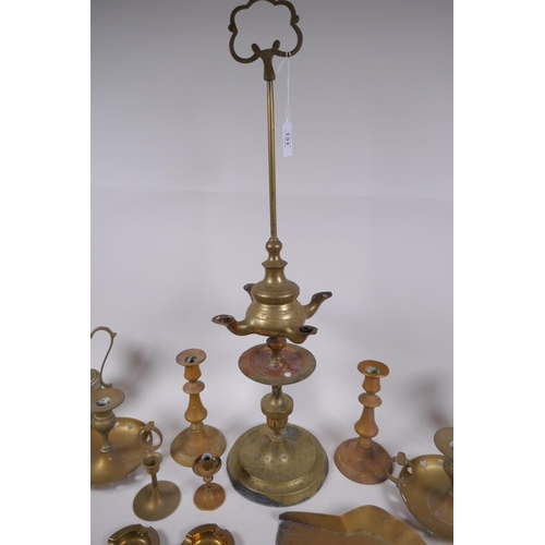 192 - A quantity of brassware including a four spout whale oil lamp, pairs of candlesticks, ash trays, coa... 