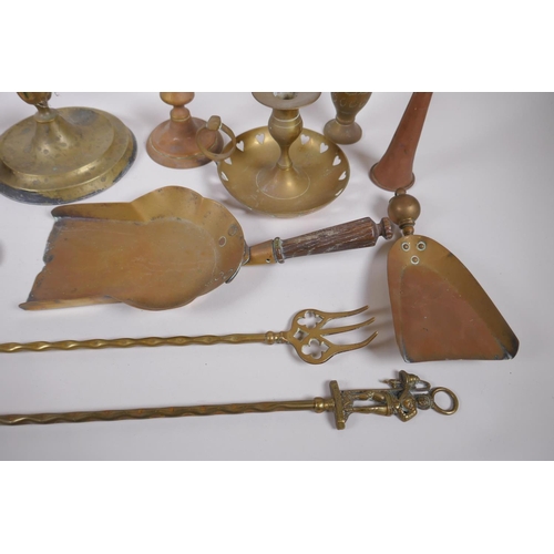 192 - A quantity of brassware including a four spout whale oil lamp, pairs of candlesticks, ash trays, coa... 