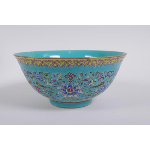 193 - A Chinese turquoise ground porcelain bowl with polychrome enamel lotus flower decoration, Qianlong s... 