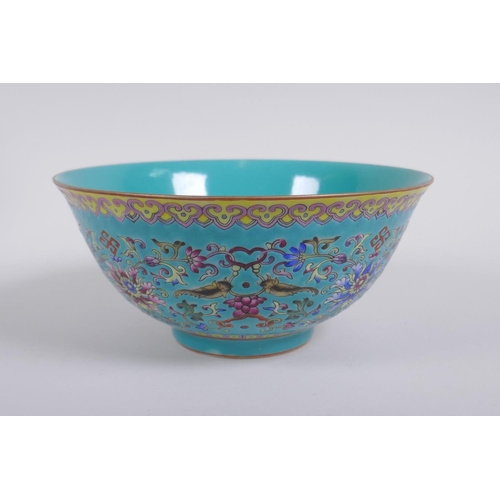 193 - A Chinese turquoise ground porcelain bowl with polychrome enamel lotus flower decoration, Qianlong s... 