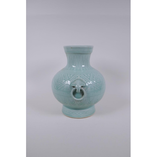 198 - A Chinese celadon glazed porcelain vase with two loop handles and patterned underglaze decoration, s... 