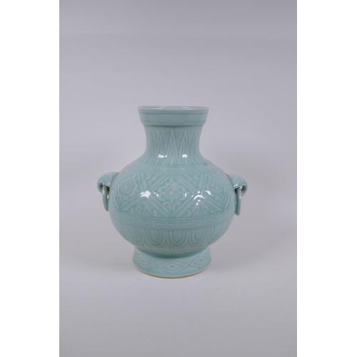 198 - A Chinese celadon glazed porcelain vase with two loop handles and patterned underglaze decoration, s... 