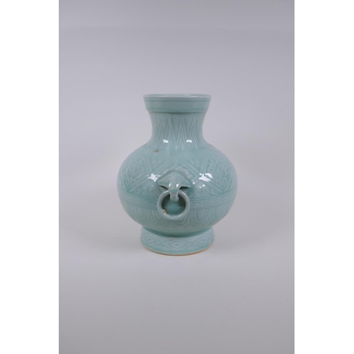 198 - A Chinese celadon glazed porcelain vase with two loop handles and patterned underglaze decoration, s... 