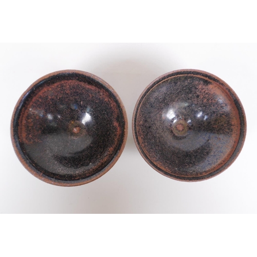 203 - A pair of Chinese Cizhou kiln tea bowls, 10 cm diameter