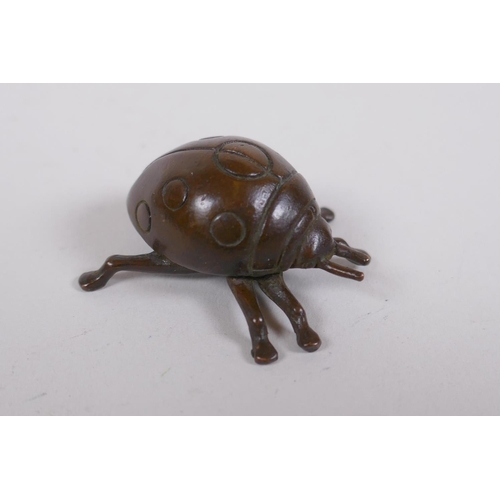 206 - A Japanese style bronze okimono ladybird, 3cm