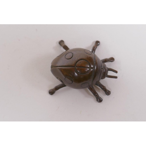 206 - A Japanese style bronze okimono ladybird, 3cm