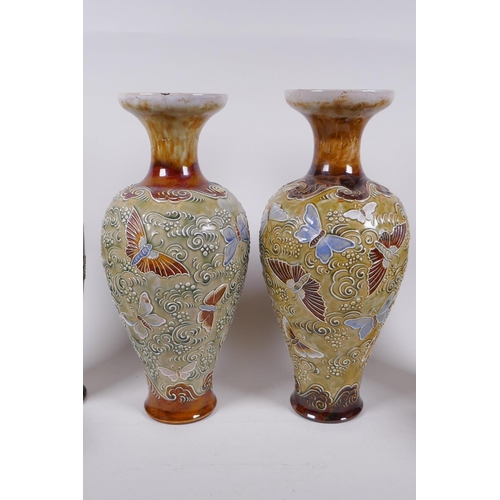 209 - A pair of Doulton Lambeth butterfly vases, a quantity of Royal Doulton stoneware and porcelain vases... 