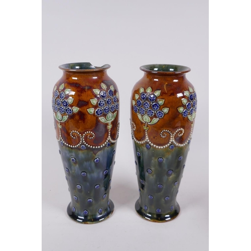 209 - A pair of Doulton Lambeth butterfly vases, a quantity of Royal Doulton stoneware and porcelain vases... 