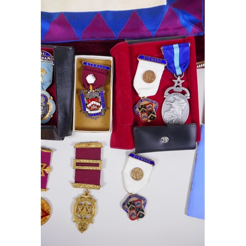 212 - A collection of Masonic regalia to include an apron, sash, assorted medals (some silver) and a quant... 