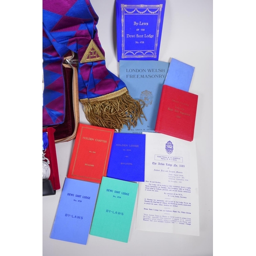 212 - A collection of Masonic regalia to include an apron, sash, assorted medals (some silver) and a quant... 