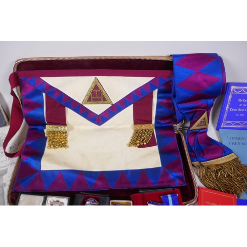 212 - A collection of Masonic regalia to include an apron, sash, assorted medals (some silver) and a quant... 