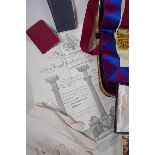 212 - A collection of Masonic regalia to include an apron, sash, assorted medals (some silver) and a quant... 