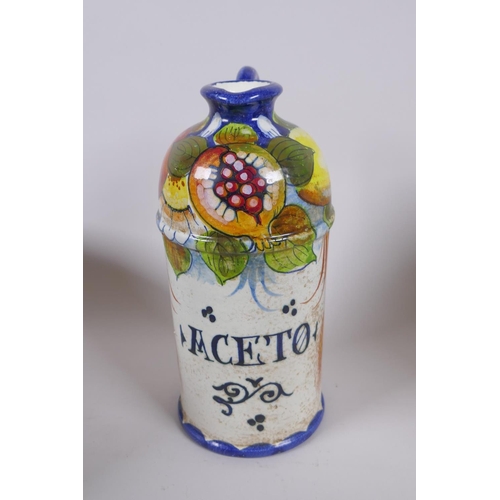 214 - A collection of Italian Majolica to include a vinegar bottle, bramble wine jug, a tureen with cover ... 