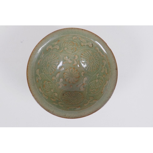 215 - A Chinese Yaozhou kiln olive glazed bowl decorated with a floral design, 10cm diameter