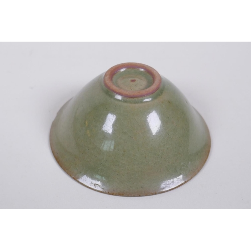 215 - A Chinese Yaozhou kiln olive glazed bowl decorated with a floral design, 10cm diameter