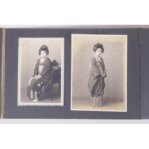 222 - A Japanese photograph album containing portrait photographs from the late C19th and early C20th