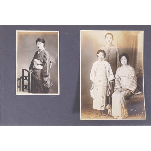 222 - A Japanese photograph album containing portrait photographs from the late C19th and early C20th