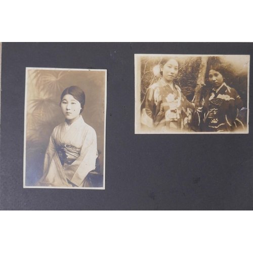 222 - A Japanese photograph album containing portrait photographs from the late C19th and early C20th