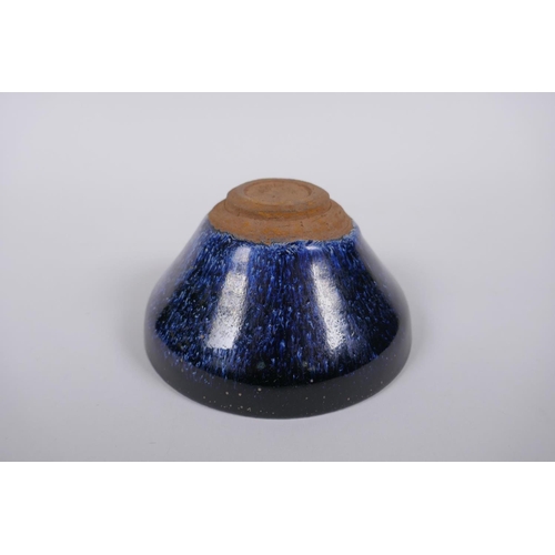 226 - A Chinese Jian kiln treacle glaze bowl with flambe detail, 13cm diameter