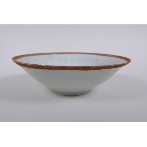 228 - A Chinese Song style celadon glazed porcelain dish of conical form, with underglaze decoration of a ... 