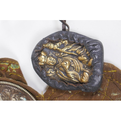 230 - A Tibetan mixed metal Gau box (travel shrine) in a fabric carry case, and a Tibetan bronze figural a... 