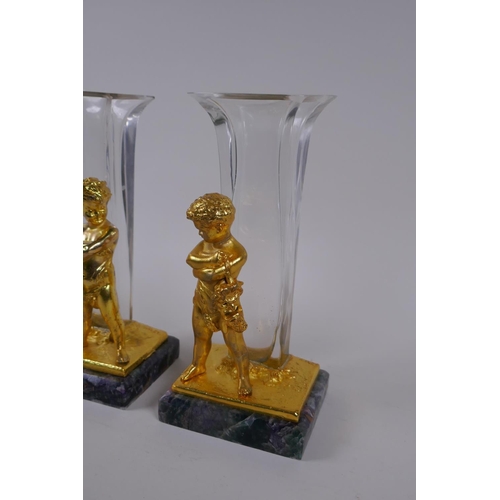 237 - A pair of gilt bronze glass stem vases with figural decoration of a child, after Louis Kley, mounted... 