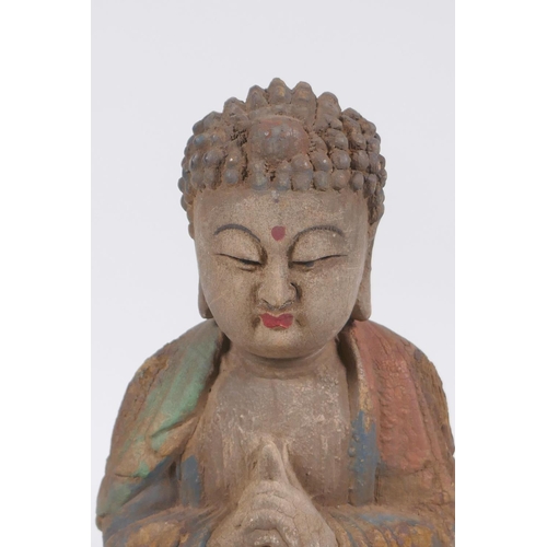 240 - A Sino Tibetan carved and painted wood figure of Buddha, 22cm high